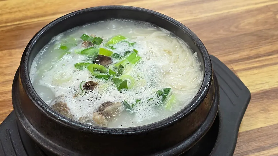 Korean beef ox tail soup served in an earthenware bowl