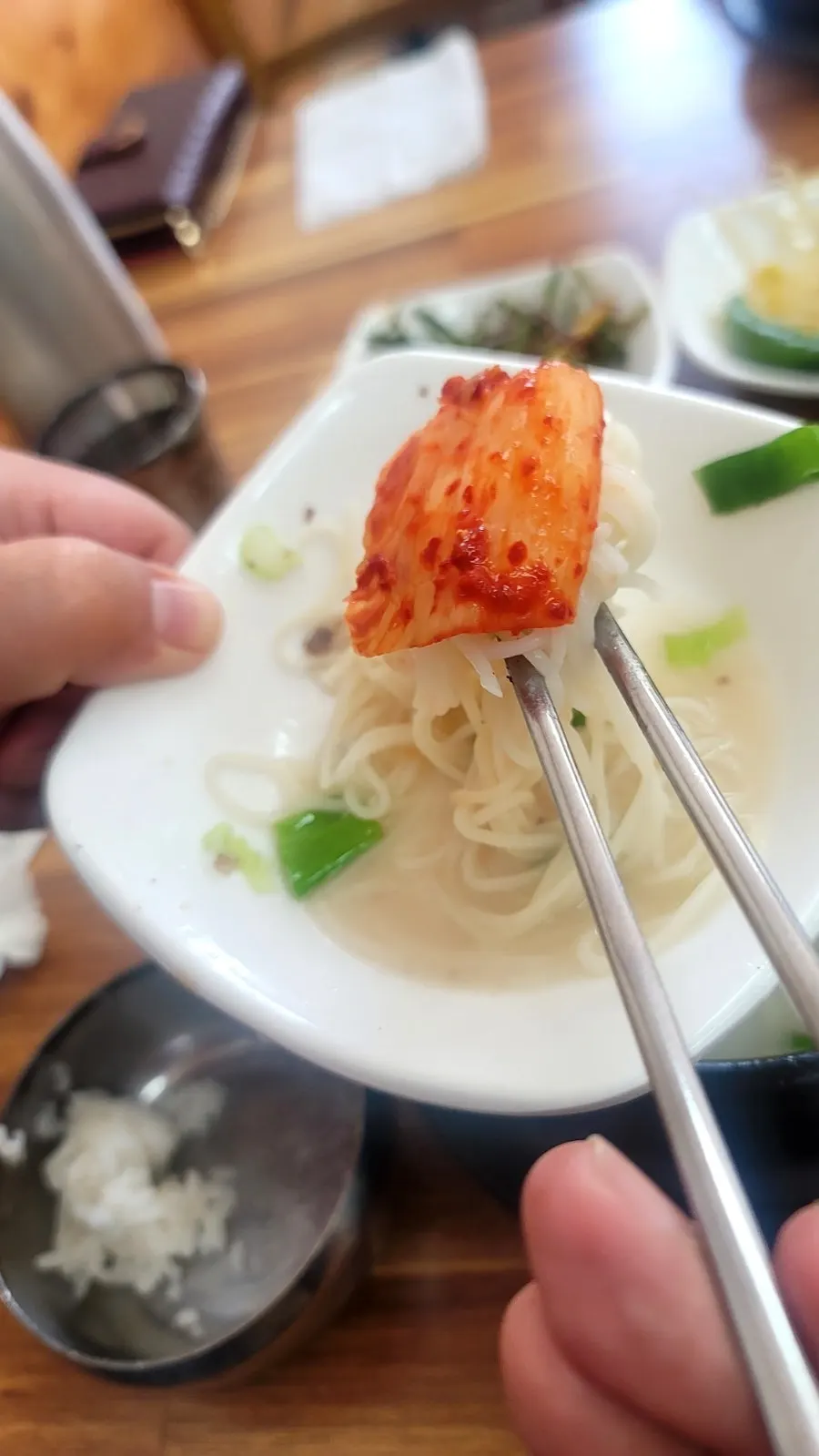 Thin wheat noodles added to rich broth