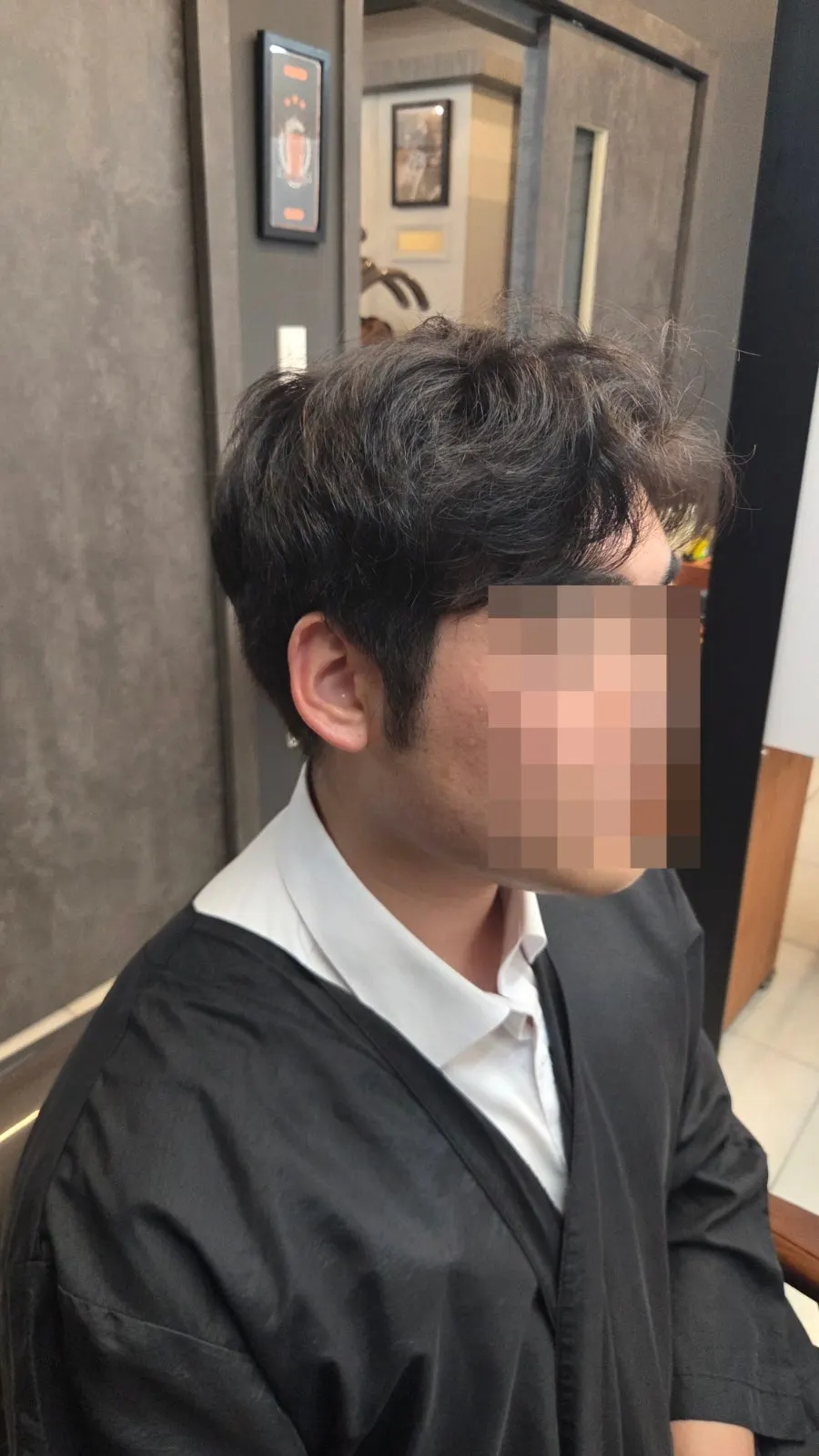 Before the service, showing lifted side hair