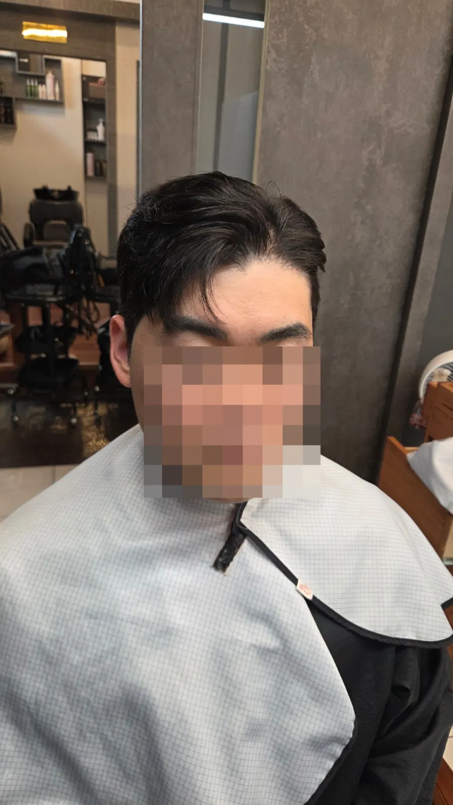 Men’s hair fit completed with a Ga-il cut and down perm