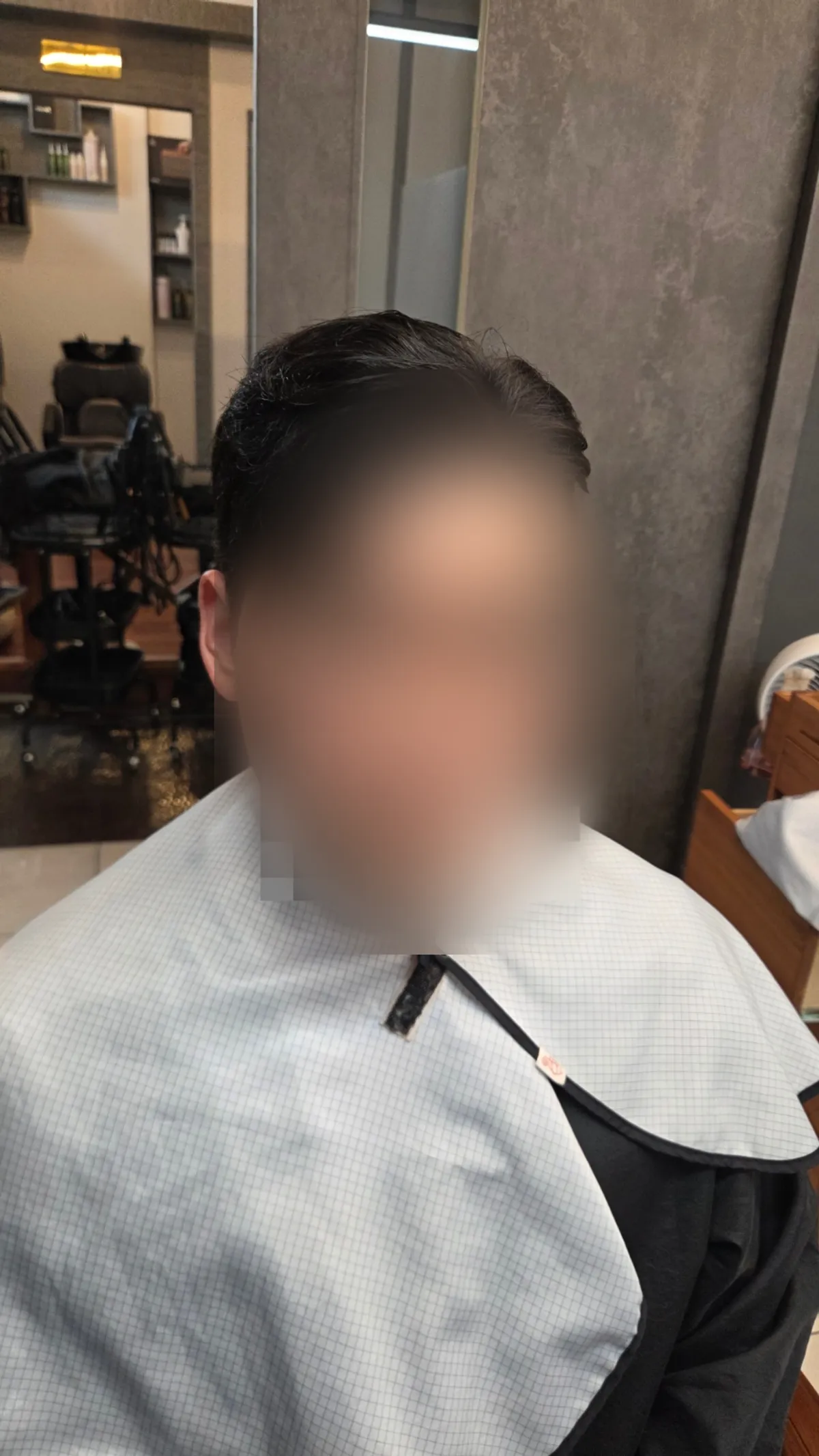Men’s hair fit completed with a Ga-il cut and down perm