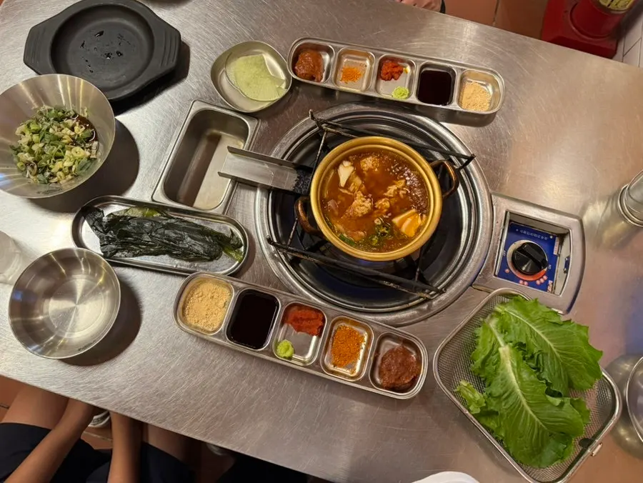 Korean side dishes and beef-brisket doenjang nurungji soup with the meat platter