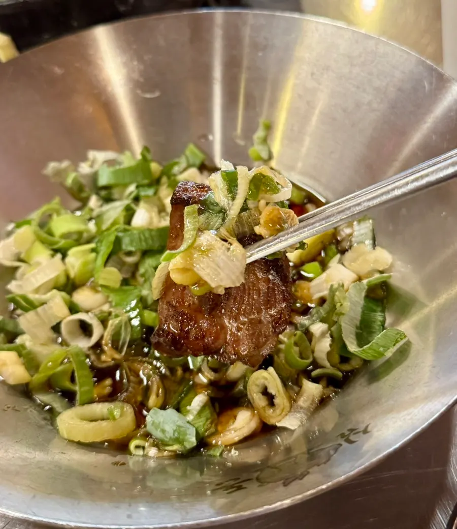 A bite of pork with salted herring roe