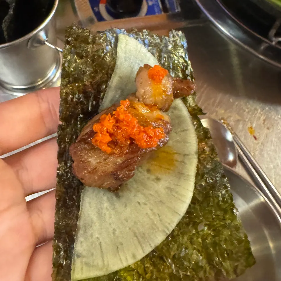 Meat paired with laver and pickled radish