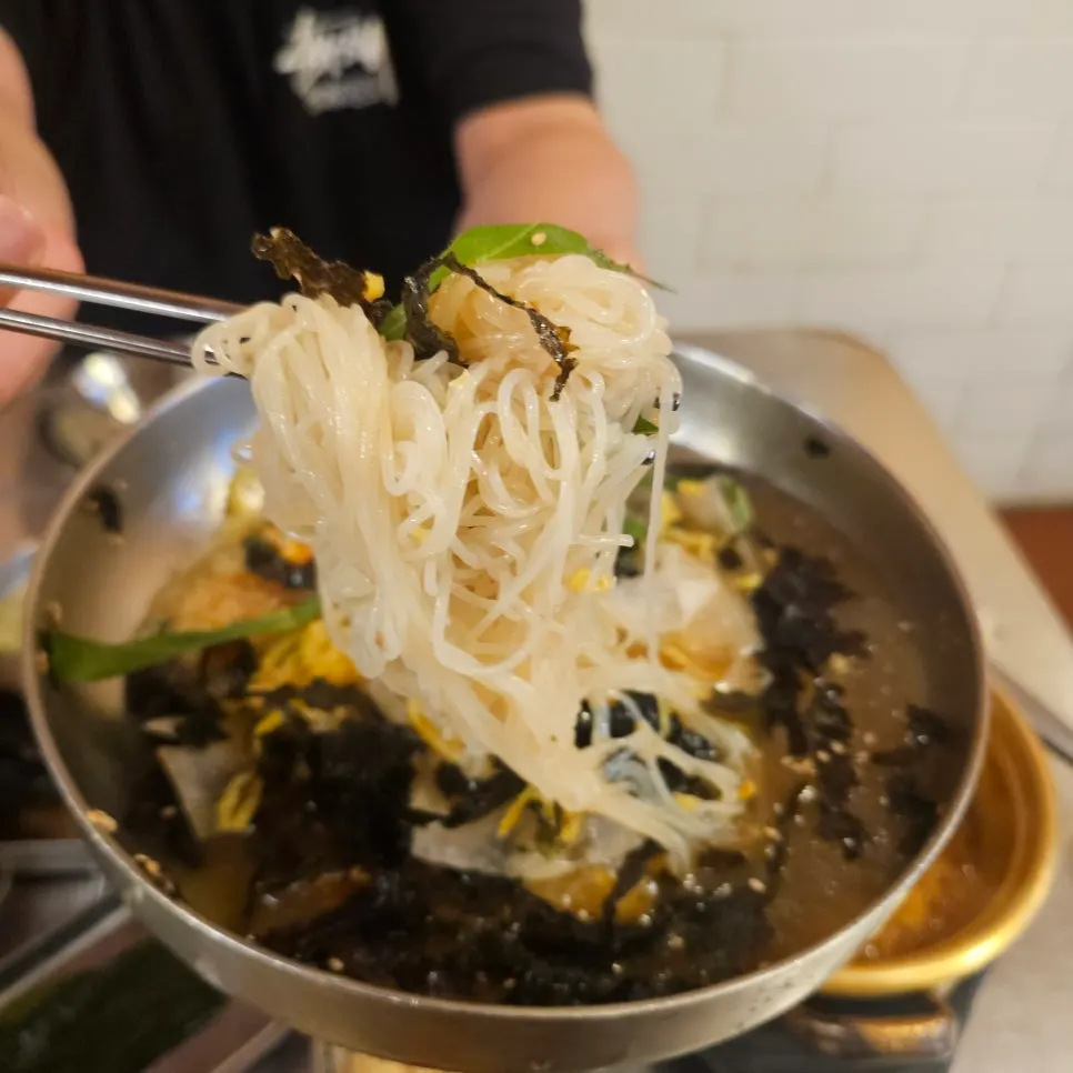 Milmyeon noodles lifted with chopsticks