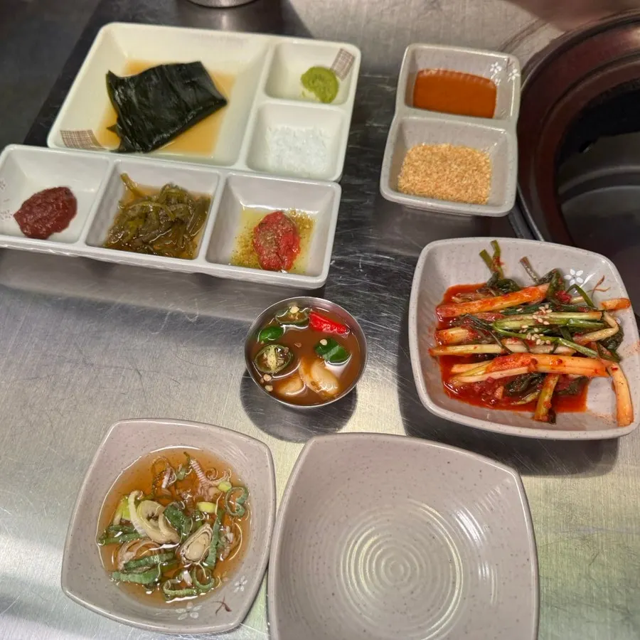 Side dishes including Maldon salt, myeoljeot, and pa-kimchi