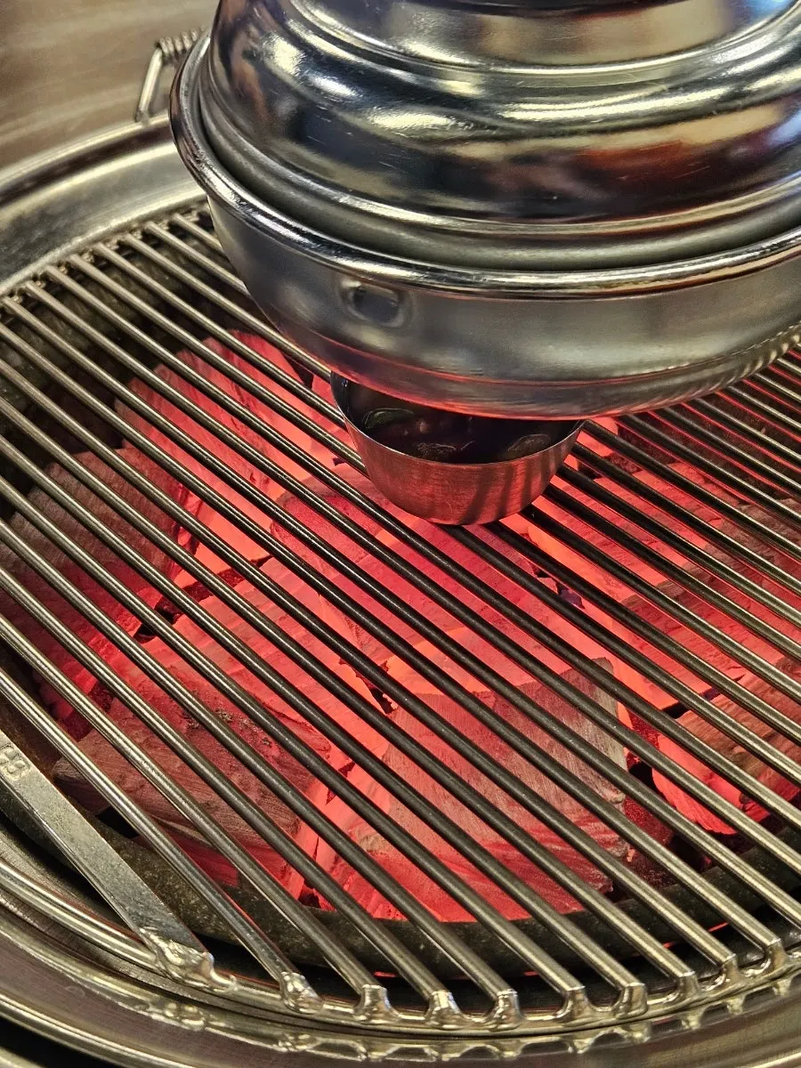 Charcoal grill set up at the table