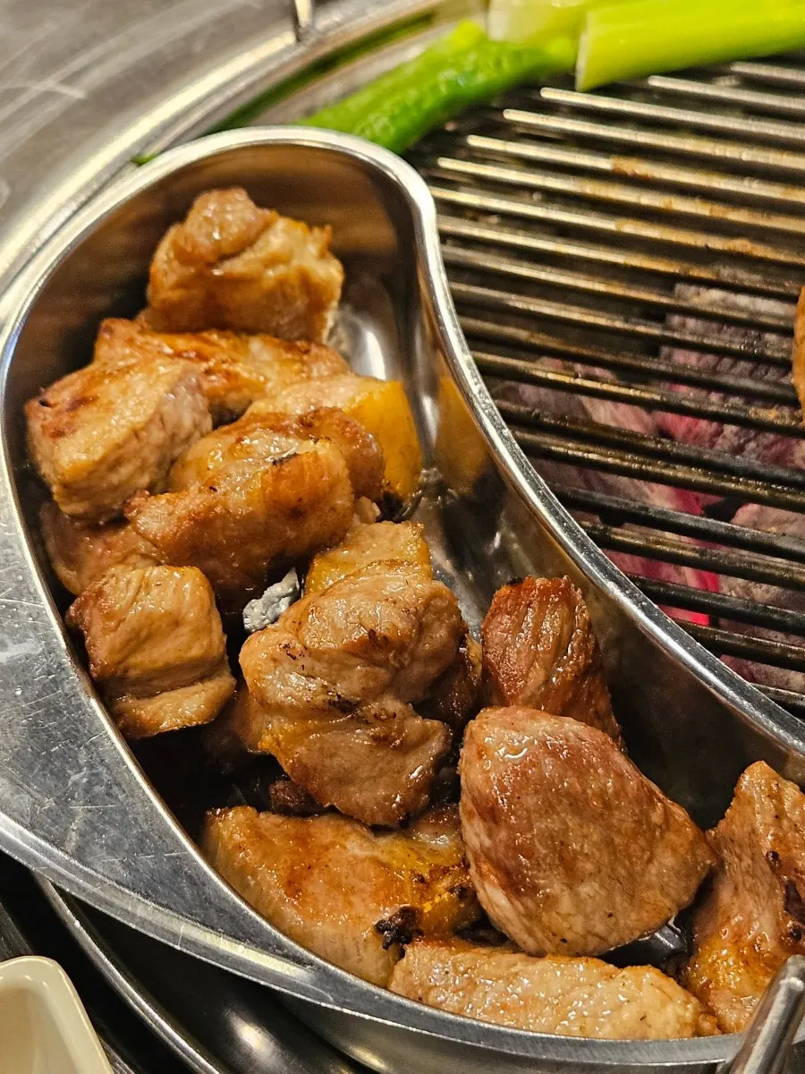 Staff grilling the pork neck