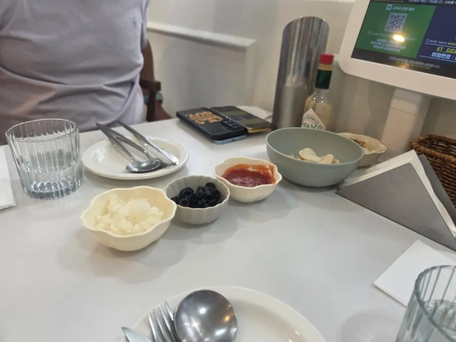 Plate of nachos and sauce from the self-serve bar