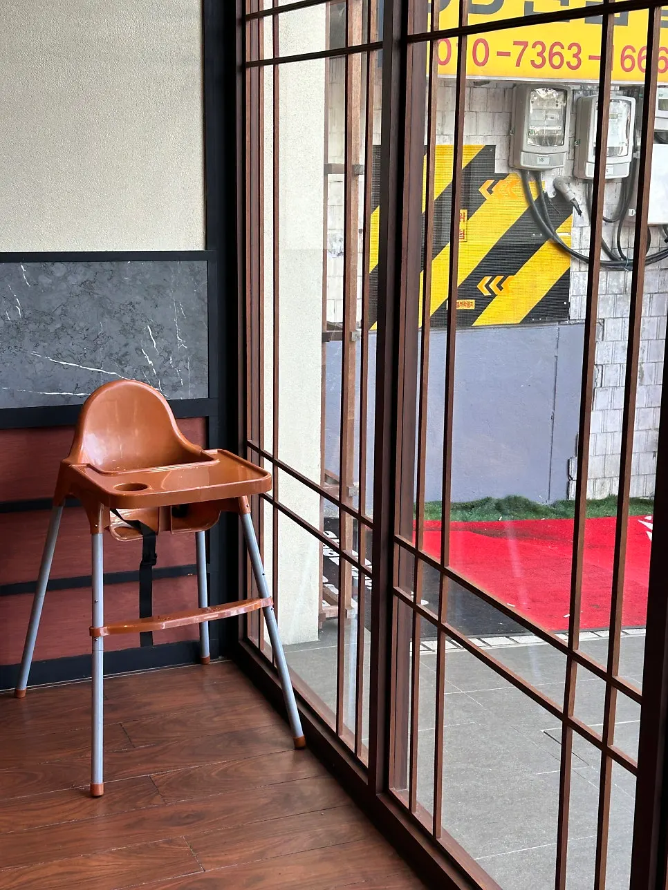 Corner of the restaurant with baby chairs ready