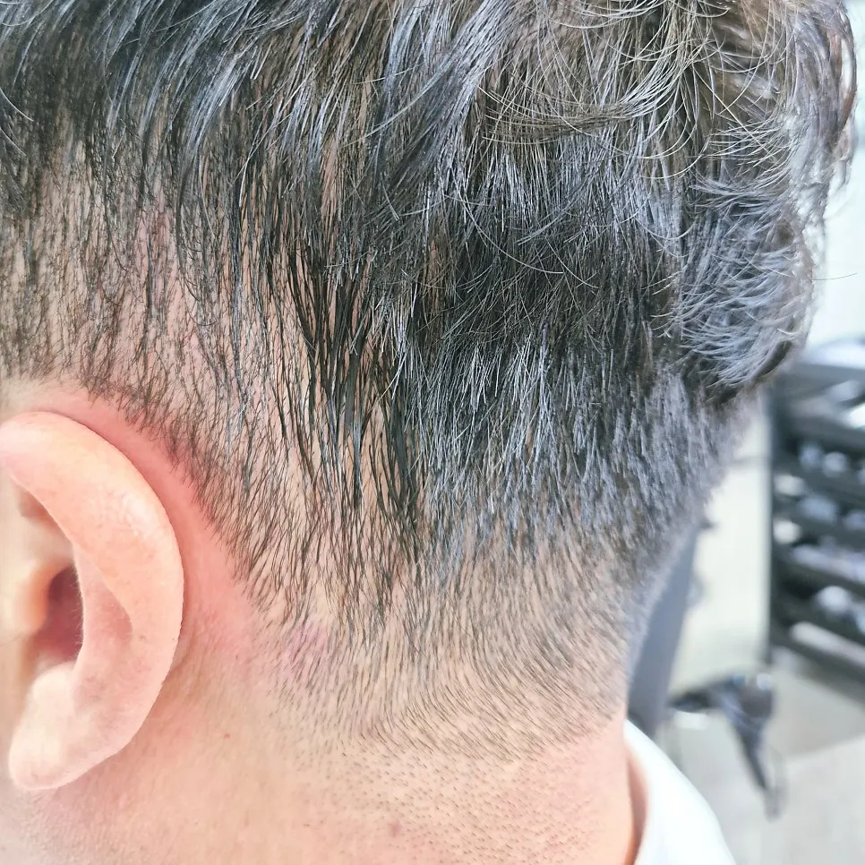 Side view of trimmed hair around the ears and sides