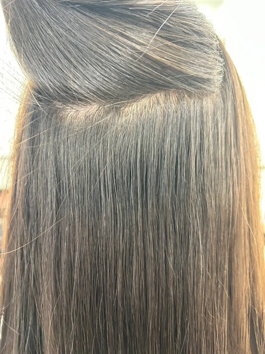Sleek, straightened hair after treatment