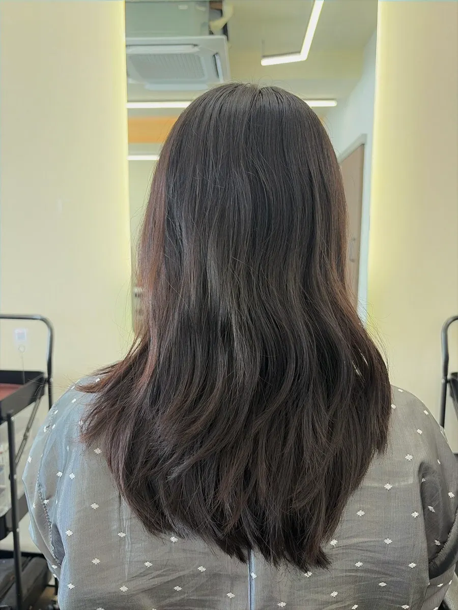 Before shot of wavy medium-length hair prior to the perm