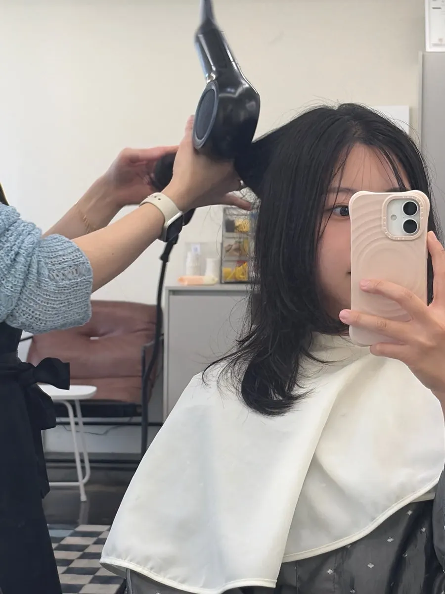 Shaping the hair with a flat iron after neutralizing
