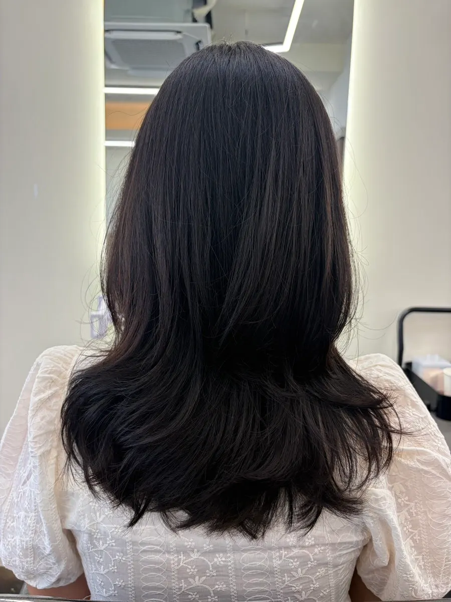 After photo of the medium-length layered C-curl perm