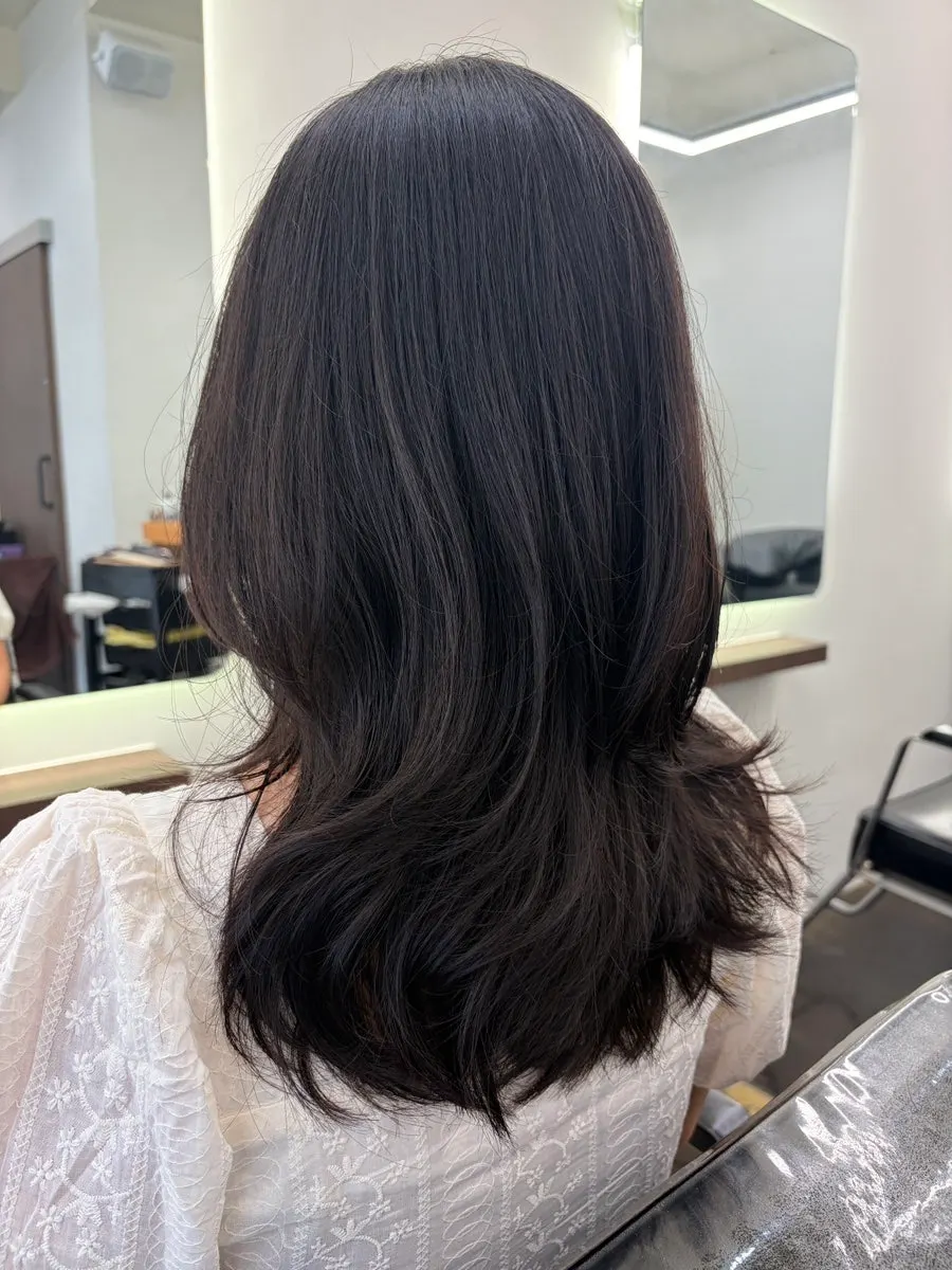 After shot showing the light, layered curls
