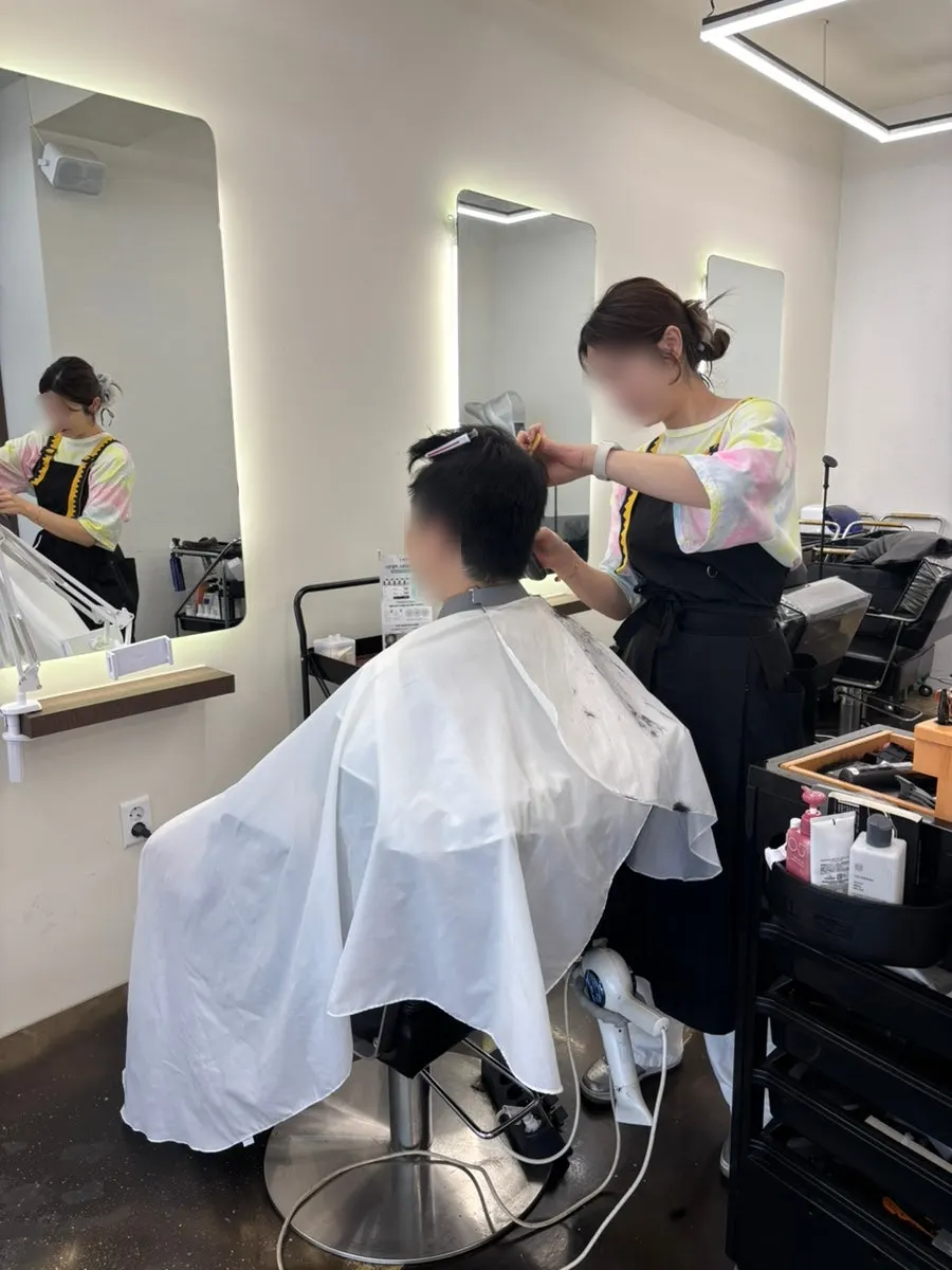 Trimming the sideburns and side hair line