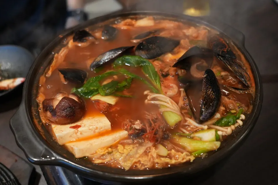 Whole shrimp taken out of the nabe onto a plate