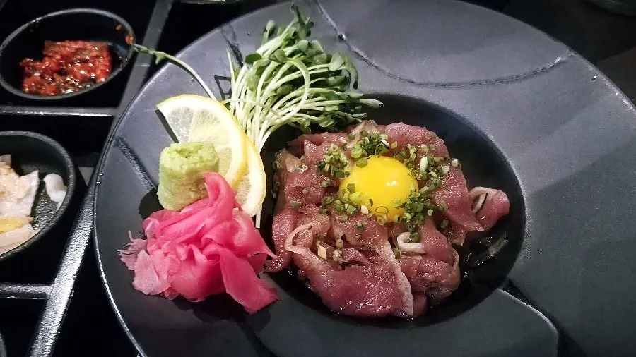 Maguro yukhoe topped with egg yolk