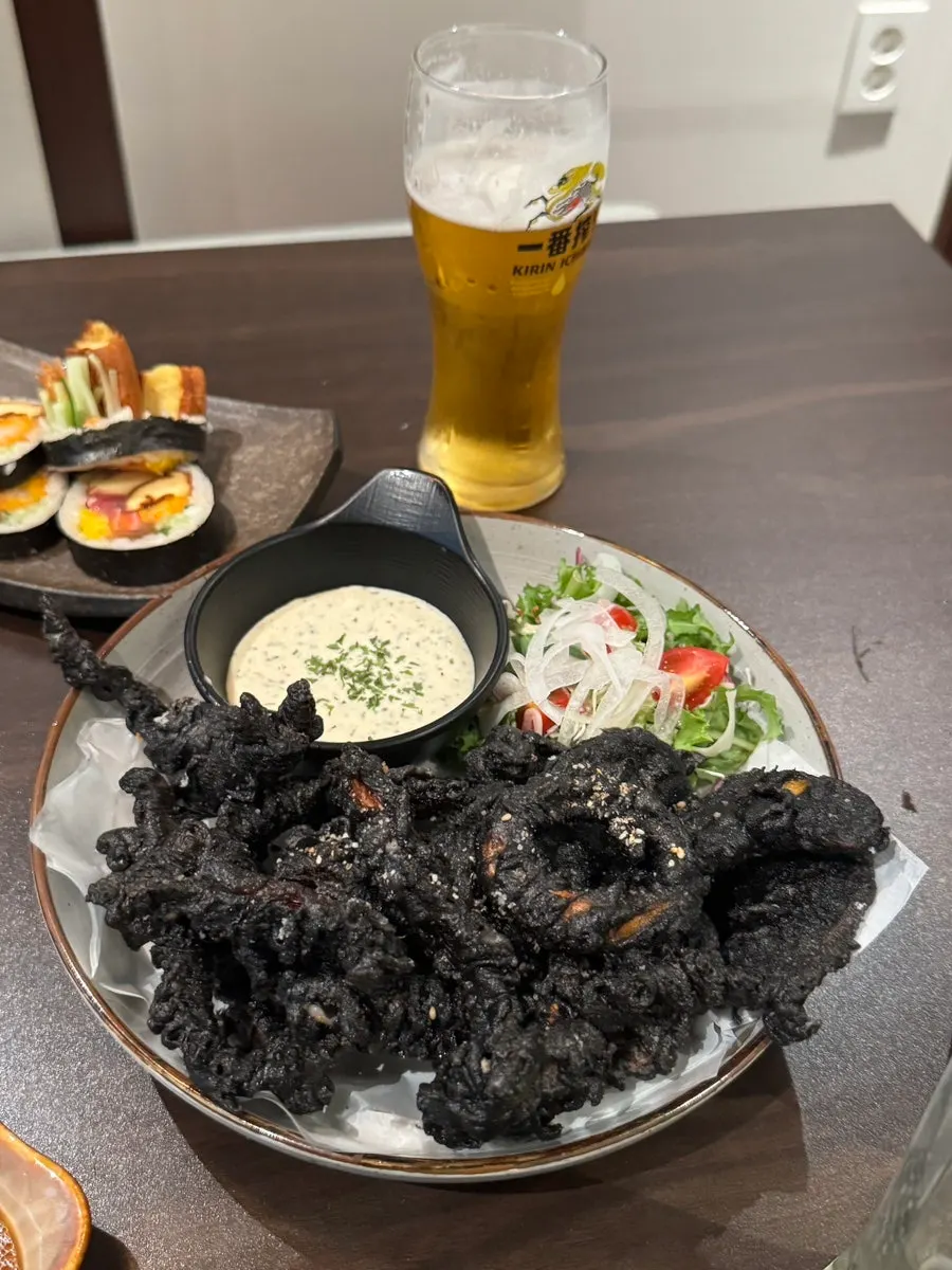 A plate of squid ink tempura