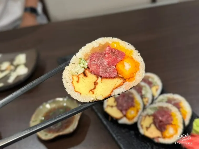 Picking up a piece of yukhoe maki