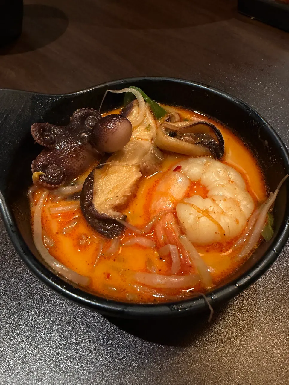 Nabe broth filled with shrimp, mussels, and webfoot octopus