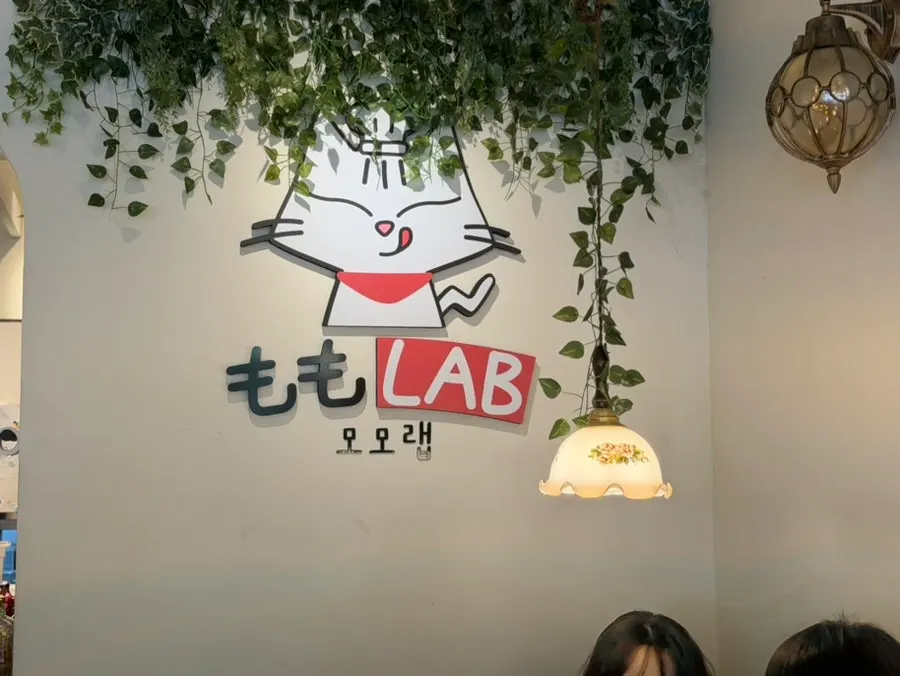 Interior of Momo Lab with 4-person tables