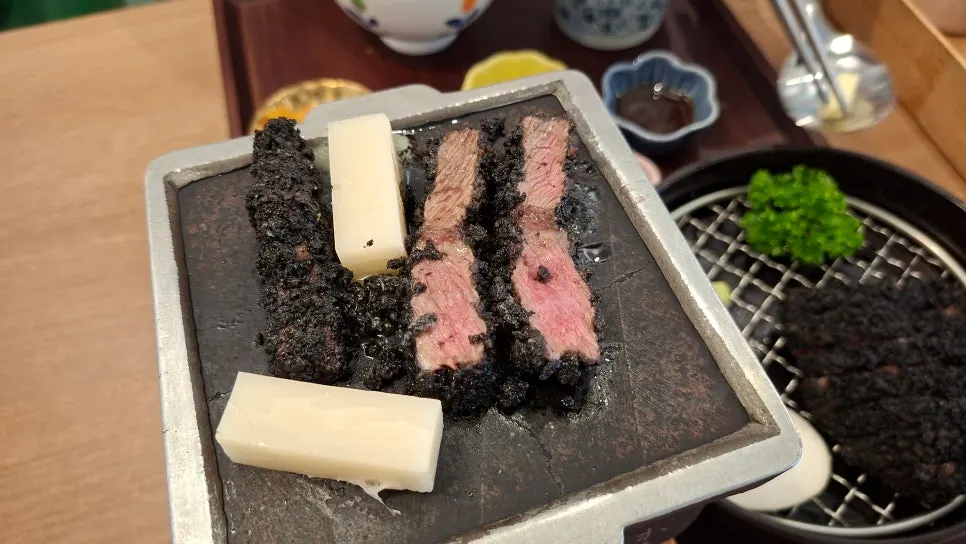 Melting butter on the brazier for the gyukatsu