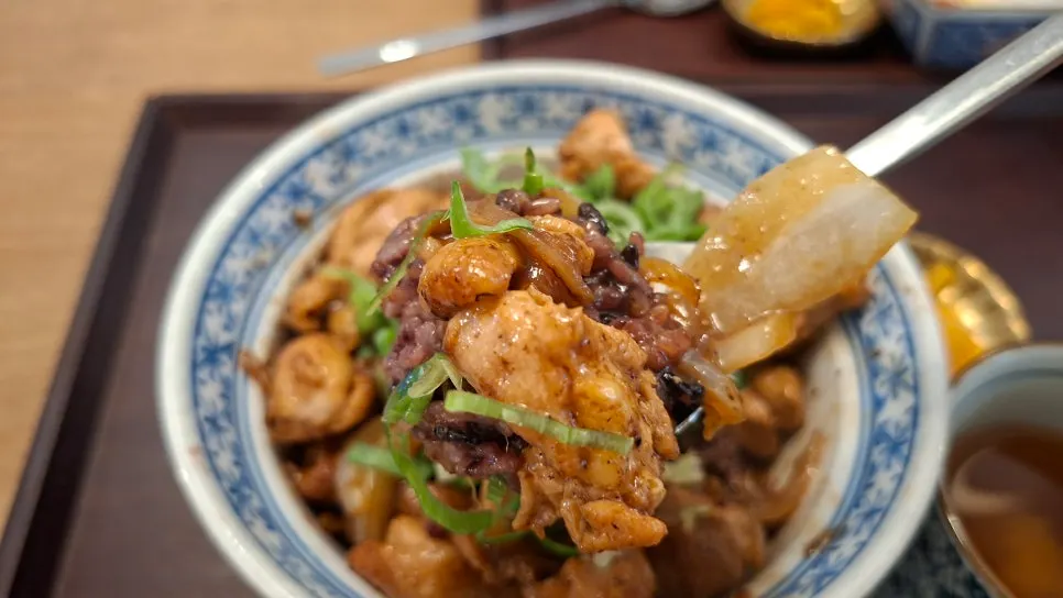 Yakitori-don topped with a raw egg