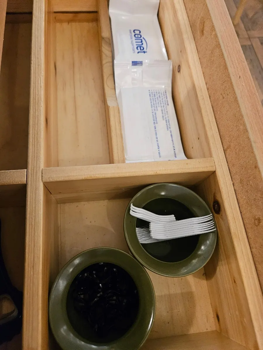 Floss and hair ties inside Momo Lab's table drawer
