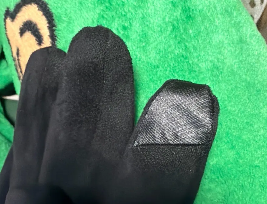 Glove with touch material on the right index finger