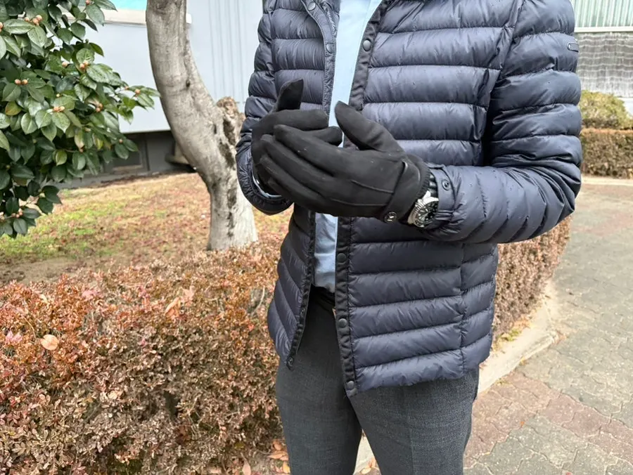 Black suede men's gloves presented as a gift