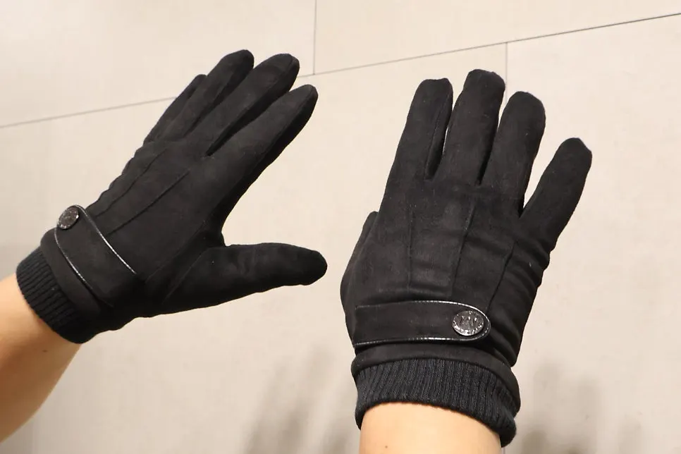 Winter gloves worn on a snowy day