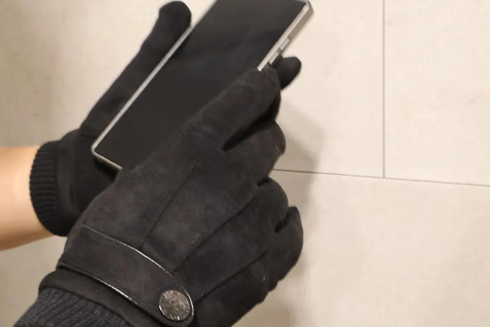 Gloves worn with a clenched hand