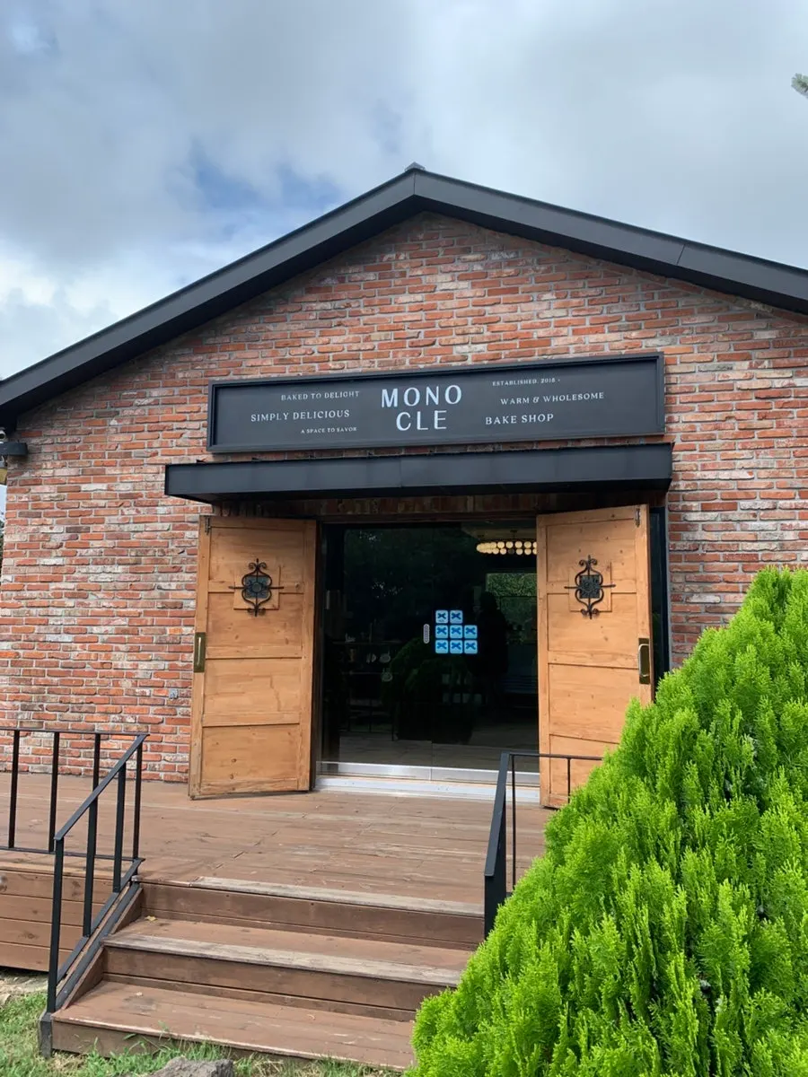 Exterior of Monocle Jeju surrounded by trees