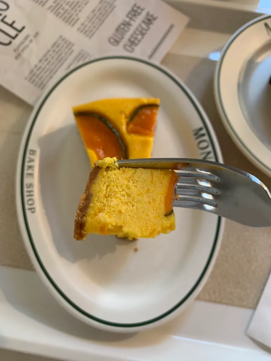 A slice of cheesecake topped with pumpkin