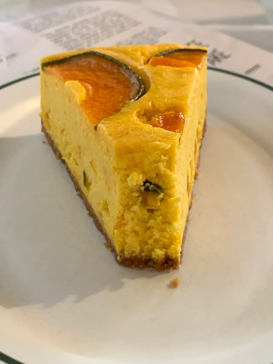 Cross-section of the sweet pumpkin cheesecake cut with a fork