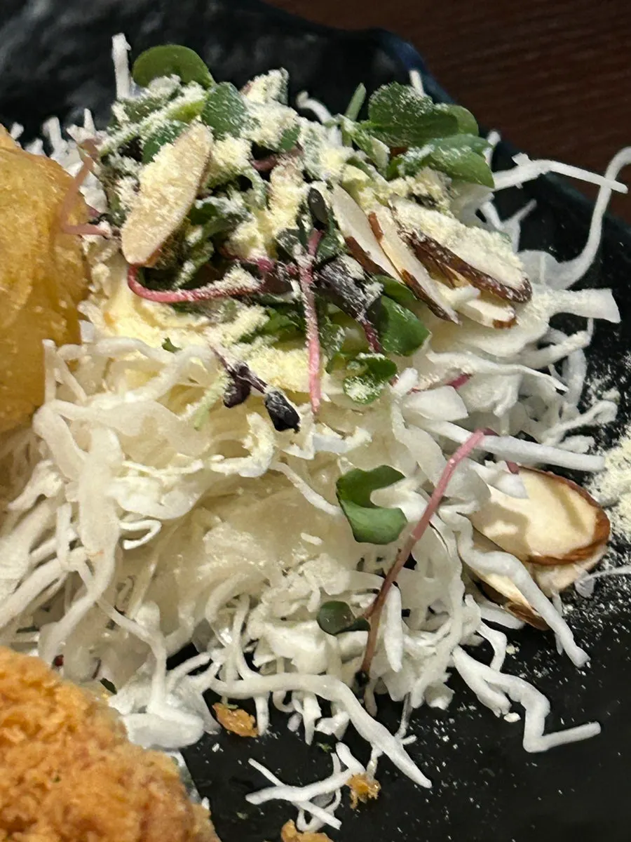 Cabbage salad served alongside the chicken