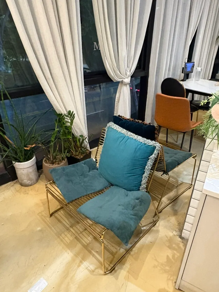 Window seat with long hanging curtains