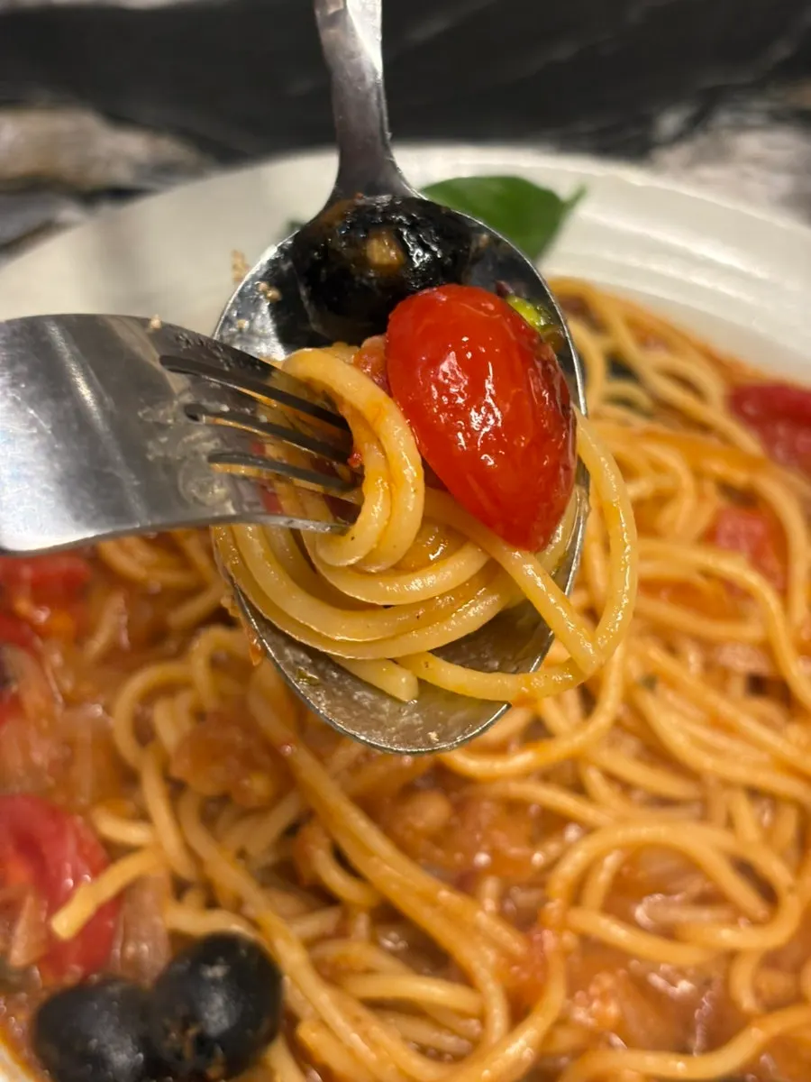 Tomato pasta topped with cherry tomatoes