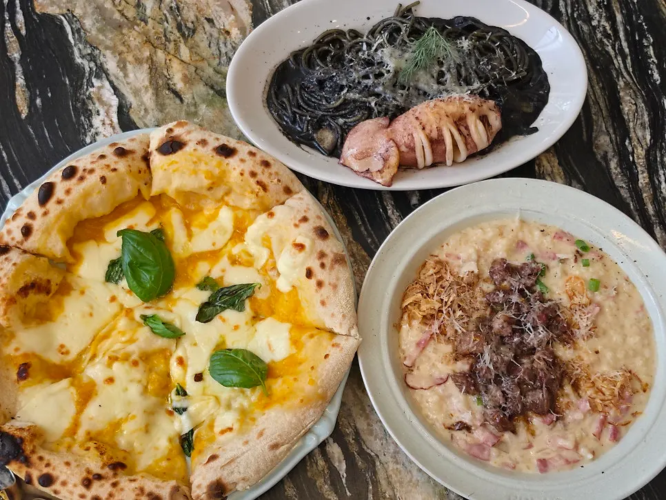 Table spread of three Western dishes ordered