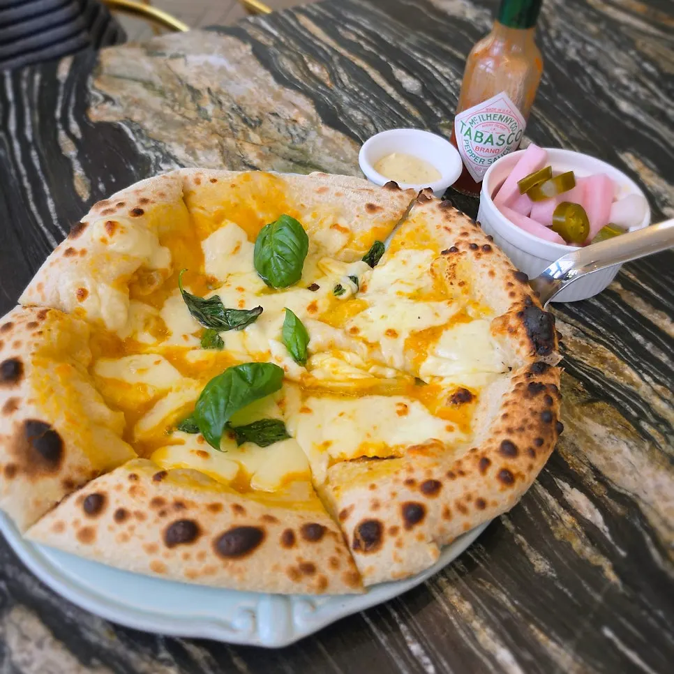 Datterino Margherita topped with yellow tomatoes