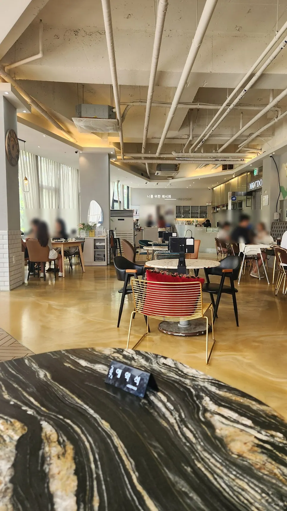 Vintage epoxy flooring and industrial-style ceiling interior
