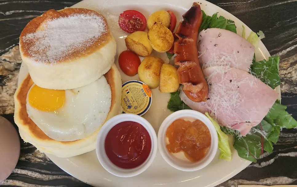 Brunch plate topped with a soufflé pancake