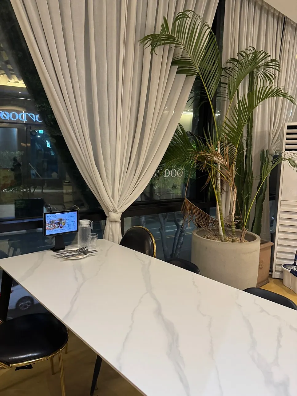 Interior of MooDoo Cheomdan with plants and objects