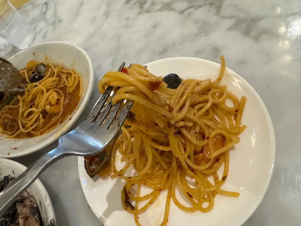 Seafood pasta with a bit of broth visible