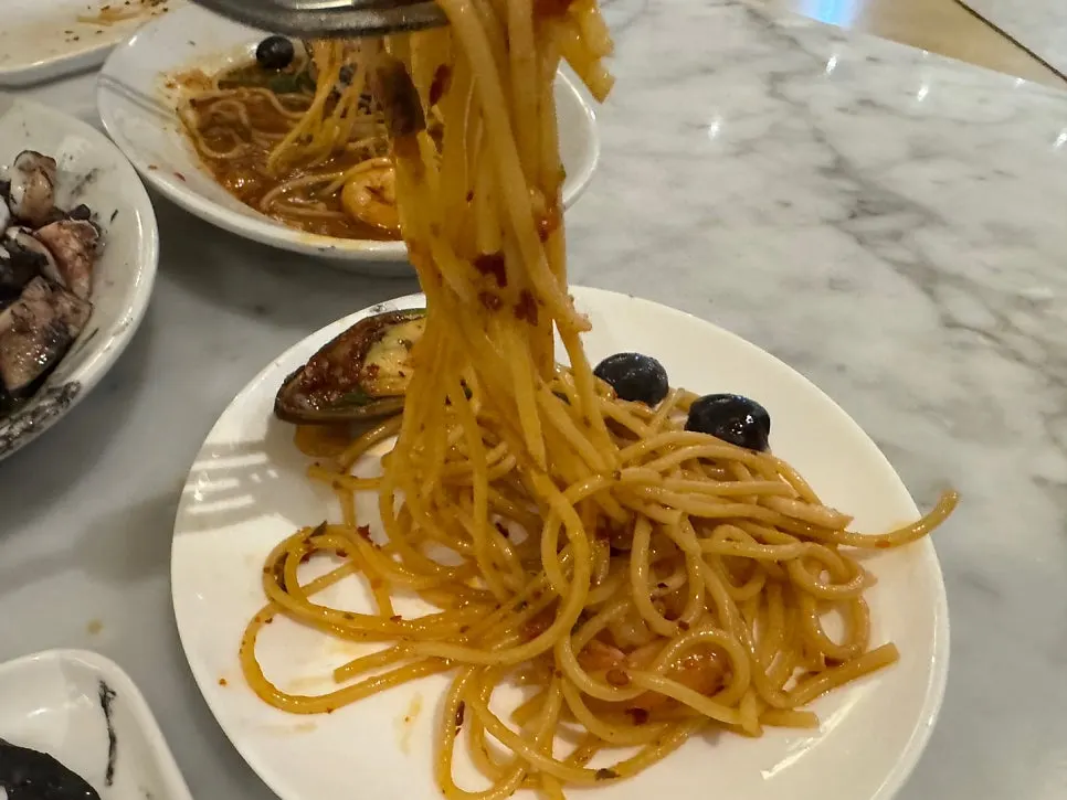 Close-up of seafood pasta topped with seafood
