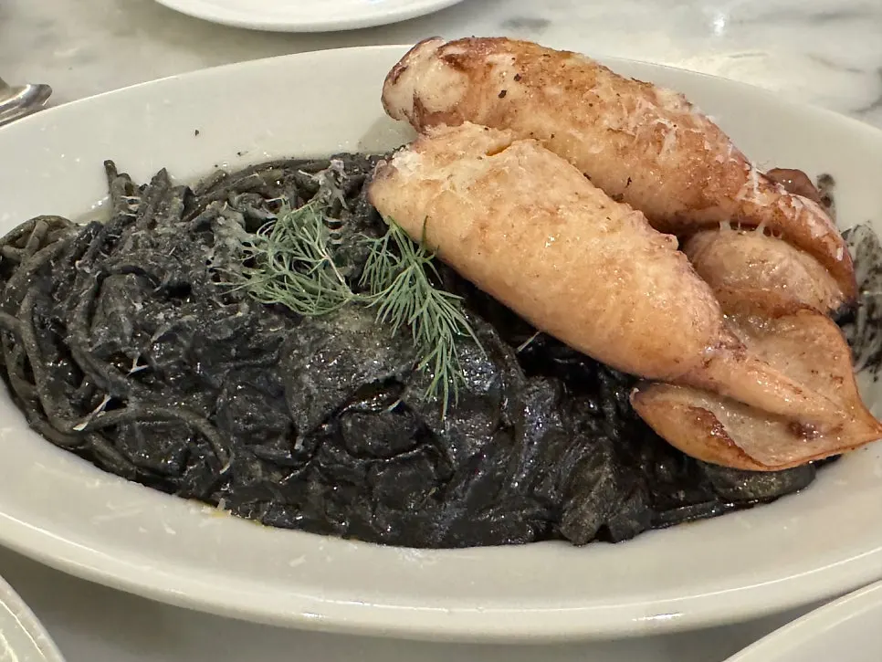 Squid ink pasta showing two squid heads