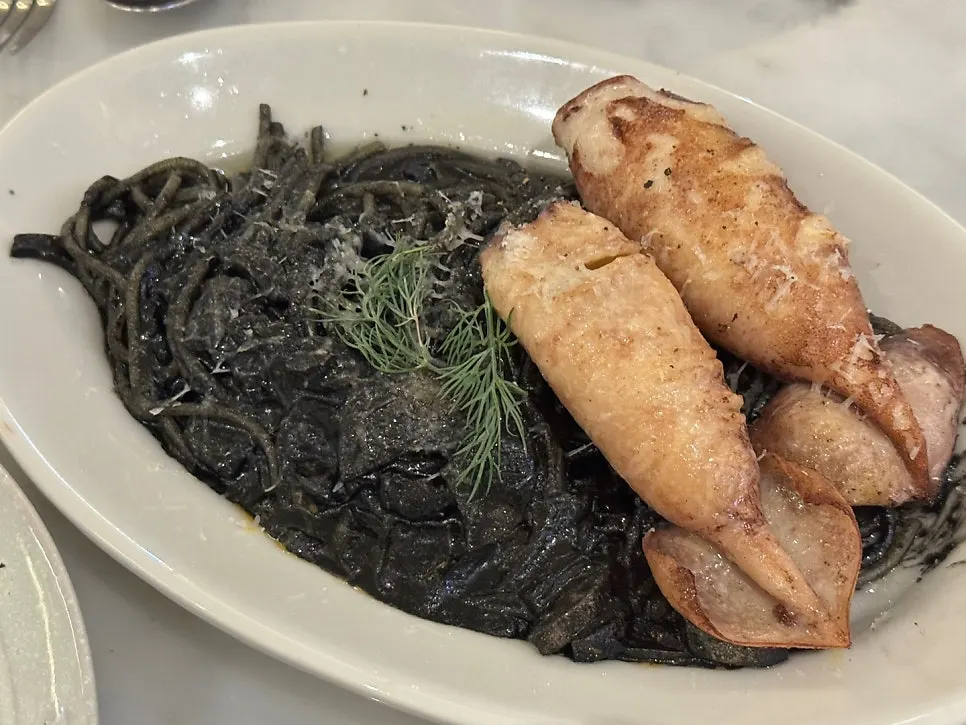 Cut squid pieces with squid ink pasta