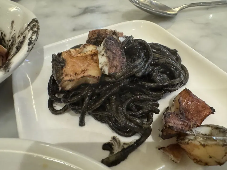 Squid ink pasta served on a plate
